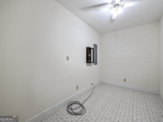 spare room with electric panel and ceiling fan