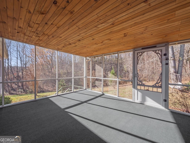 unfurnished sunroom featuring wood ceiling