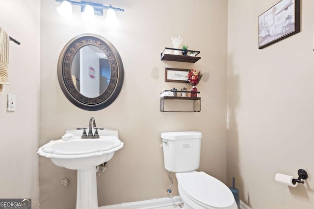 bathroom featuring toilet