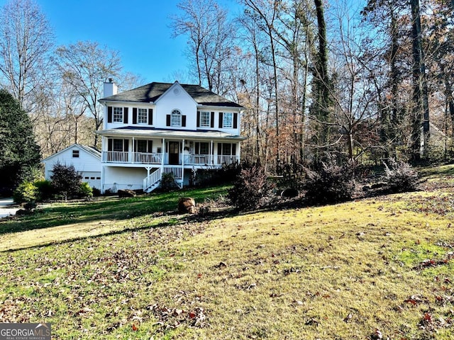 view of front of home with a front yard and a porch