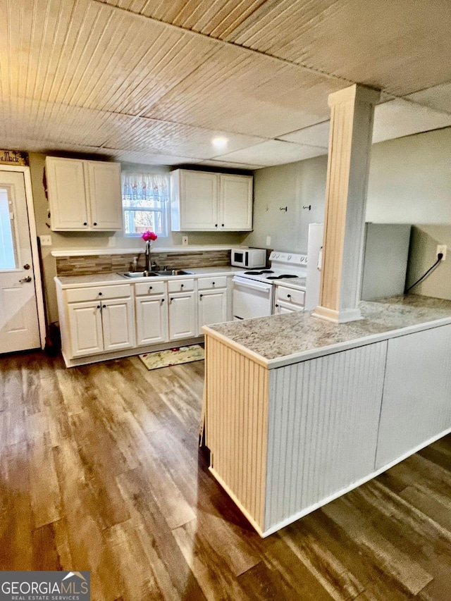 kitchen with sink, white cabinets, white appliances, and light wood-type flooring