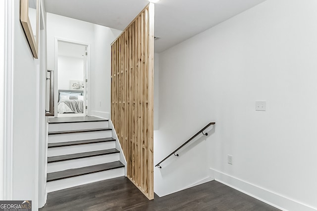 stairs with hardwood / wood-style floors