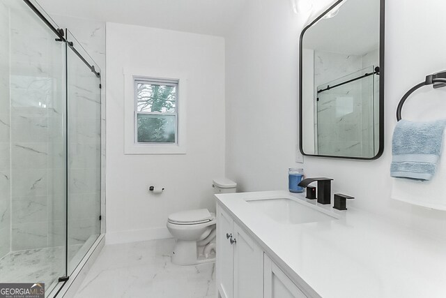 bathroom with vanity, toilet, and walk in shower