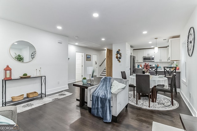 living room featuring dark hardwood / wood-style floors