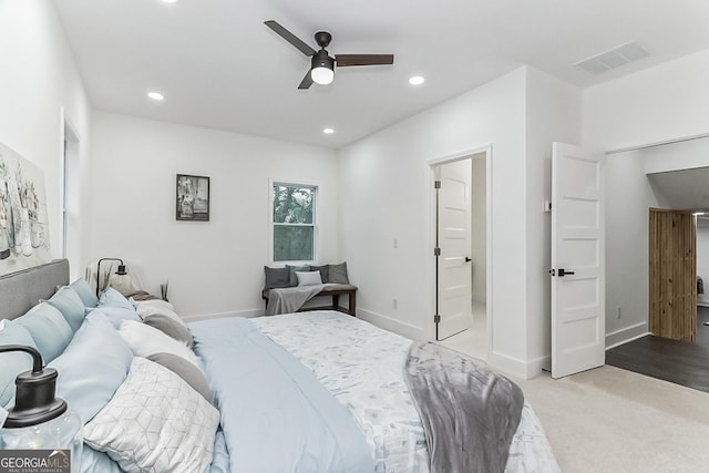 bedroom featuring light carpet and ceiling fan