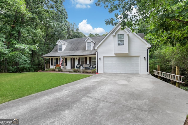 view of front of home with a front lawn, a porch, and a garage