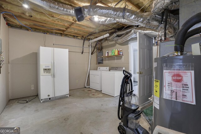 basement featuring white refrigerator with ice dispenser, electric water heater, electric panel, and separate washer and dryer