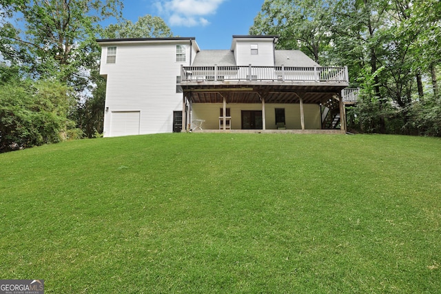 back of house with a lawn and a wooden deck