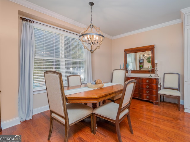 dining space featuring an inviting chandelier, wood-type flooring, and ornamental molding