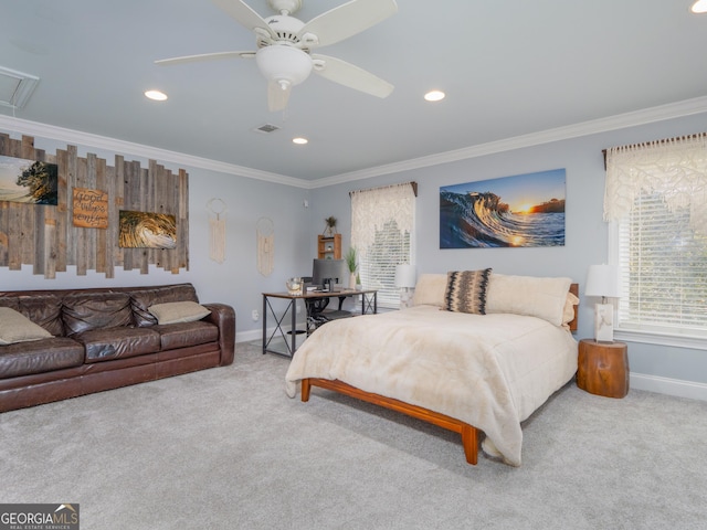 carpeted bedroom with ceiling fan and crown molding