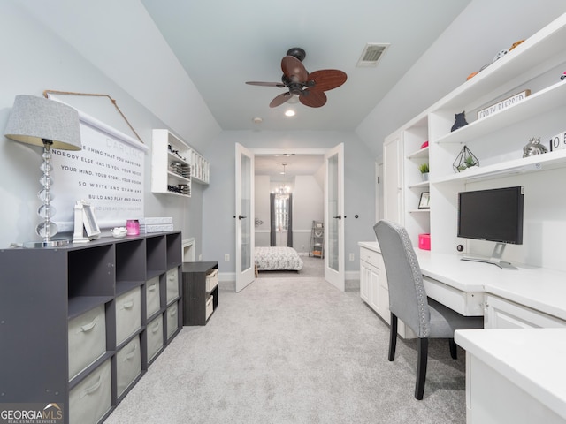 home office featuring ceiling fan with notable chandelier, light colored carpet, and french doors