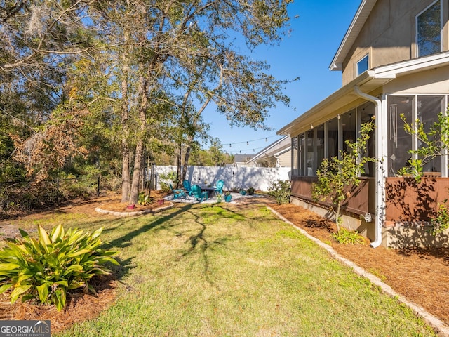 view of yard with a sunroom