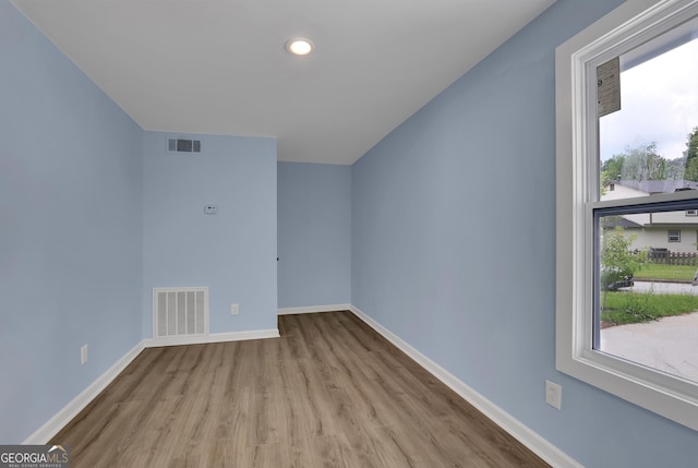 spare room featuring light wood-type flooring