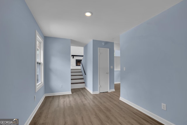 unfurnished living room featuring light hardwood / wood-style flooring