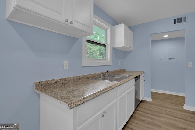 kitchen with dishwasher, light hardwood / wood-style floors, white cabinetry, and sink