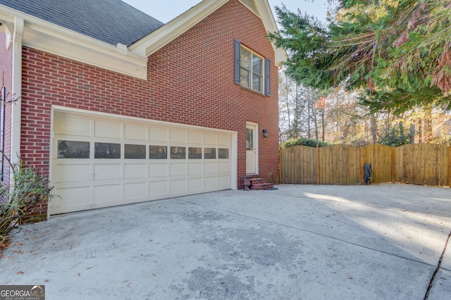 view of side of property featuring a garage