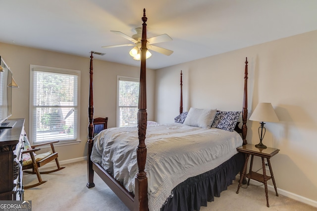 bedroom with light colored carpet and ceiling fan