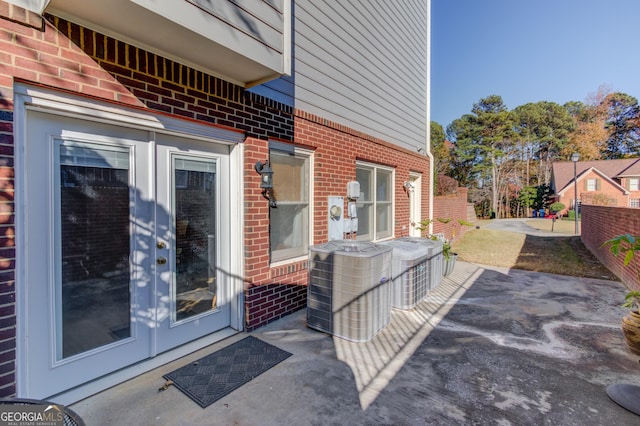 exterior space featuring french doors, a patio, and central air condition unit