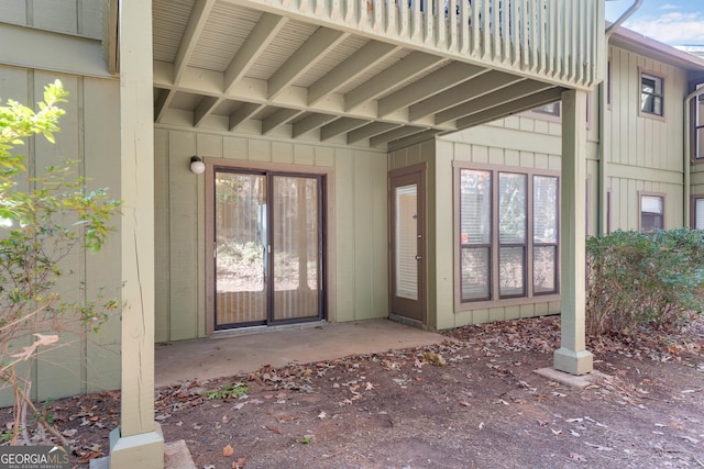 entrance to property featuring a patio