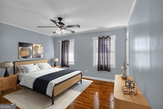 bedroom featuring ceiling fan, ornamental molding, and dark hardwood / wood-style floors