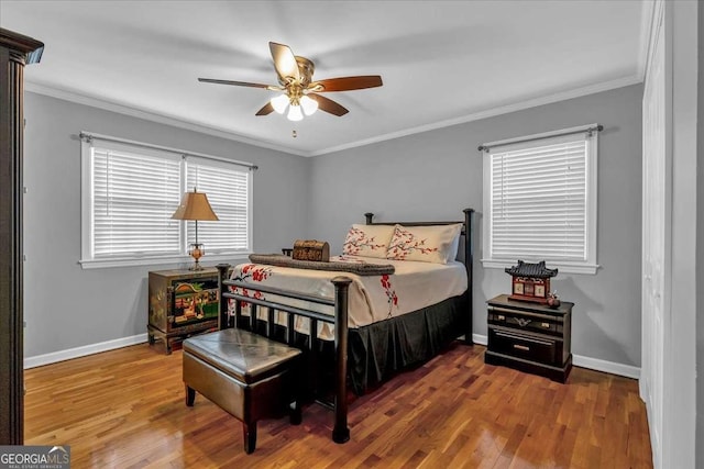 bedroom with ornamental molding, ceiling fan, and hardwood / wood-style floors