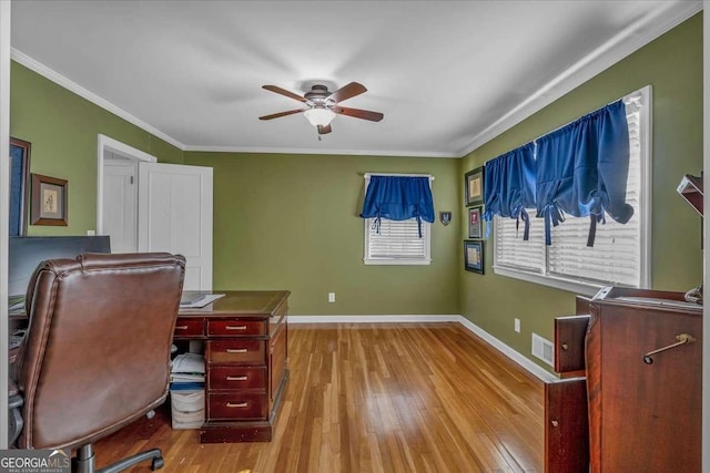 home office with ceiling fan, ornamental molding, and light hardwood / wood-style flooring