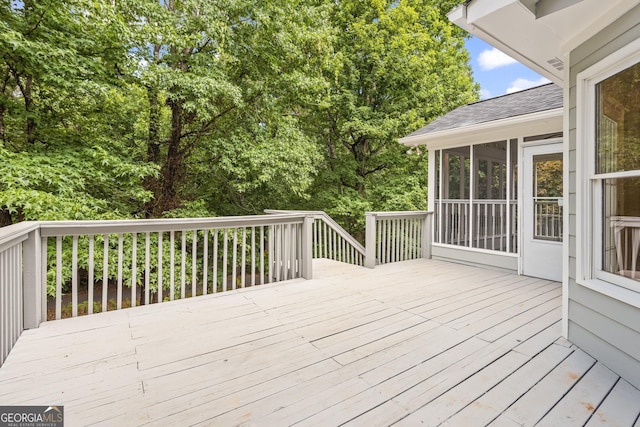 deck with a sunroom