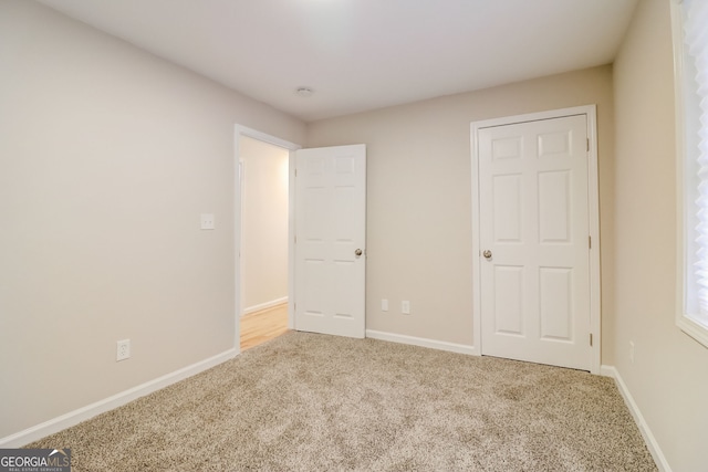 unfurnished bedroom featuring carpet flooring