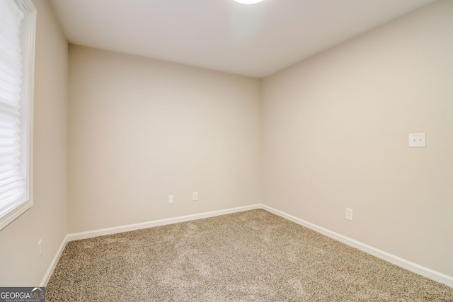 unfurnished room featuring carpet floors