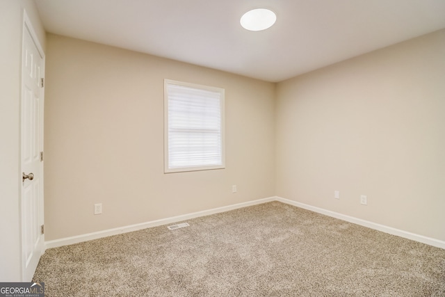 unfurnished room featuring carpet