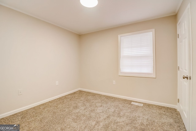 view of carpeted spare room