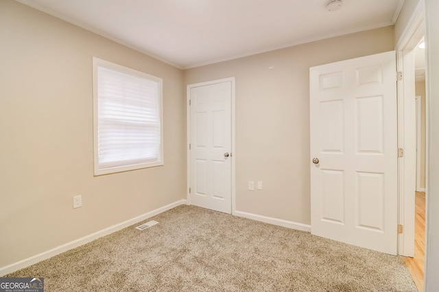 unfurnished bedroom featuring carpet flooring