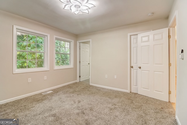 unfurnished bedroom with carpet