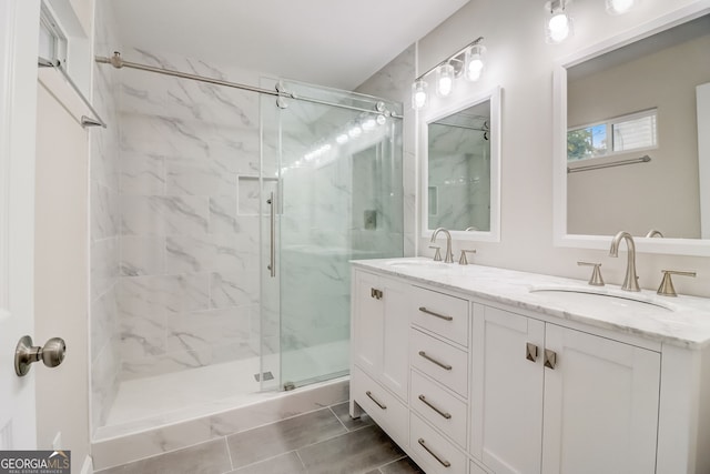 bathroom featuring vanity, tile patterned floors, and an enclosed shower