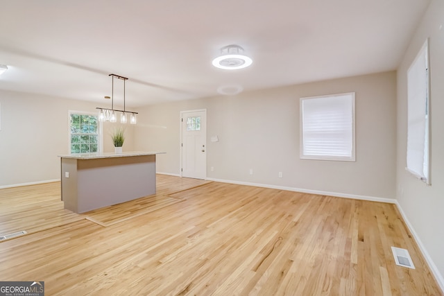 unfurnished room featuring light wood-type flooring