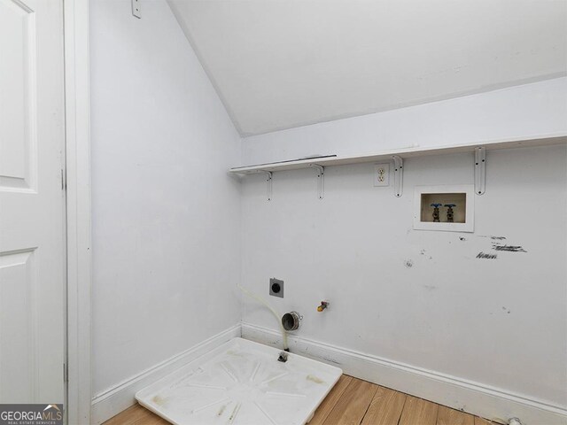 laundry area featuring washer hookup, hookup for a gas dryer, electric dryer hookup, and wood-type flooring