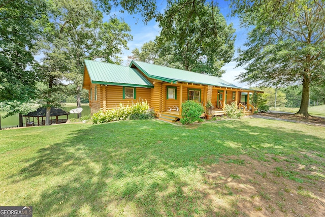 log home with a gazebo, a porch, and a front yard