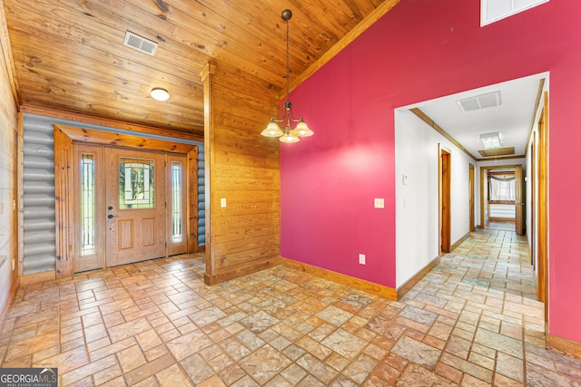 entryway with wooden ceiling, a chandelier, lofted ceiling, and ornamental molding