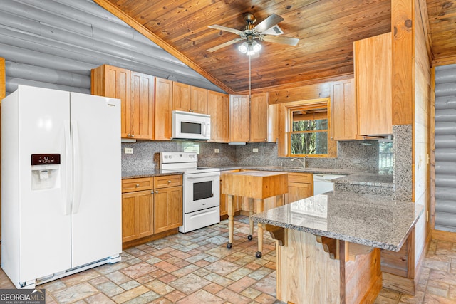 kitchen featuring a kitchen bar, white appliances, tasteful backsplash, and light stone countertops