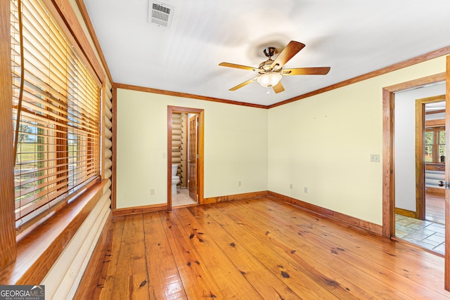 spare room with ceiling fan, light hardwood / wood-style floors, and ornamental molding