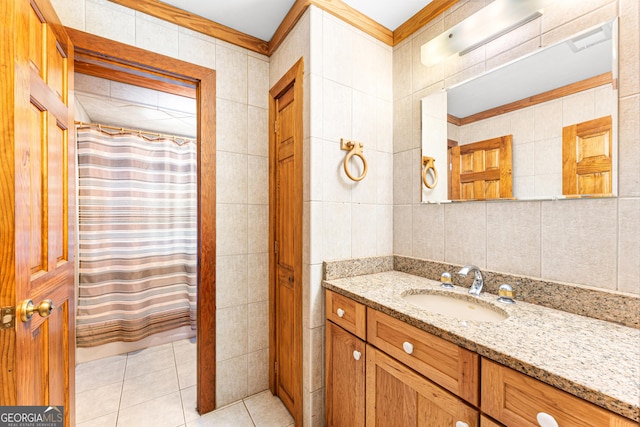 bathroom with tile patterned floors, vanity, tile walls, and walk in shower