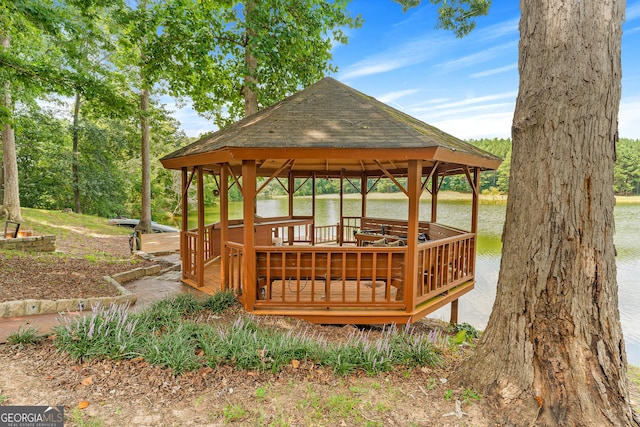 wooden terrace with a gazebo and a water view