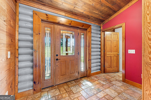 foyer with wood ceiling, lofted ceiling, and log walls