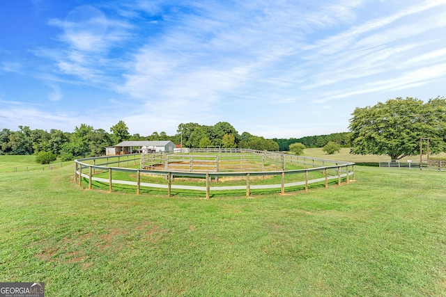 view of yard with a rural view