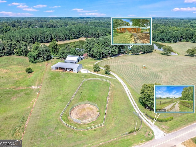 drone / aerial view with a rural view and a view of trees