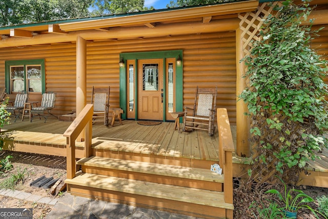 property entrance with covered porch