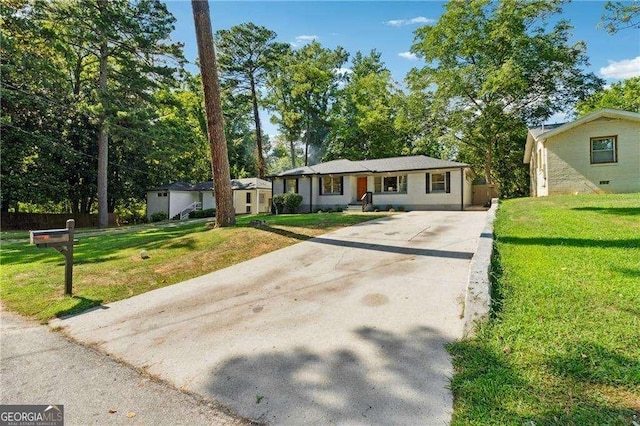 single story home featuring a front yard