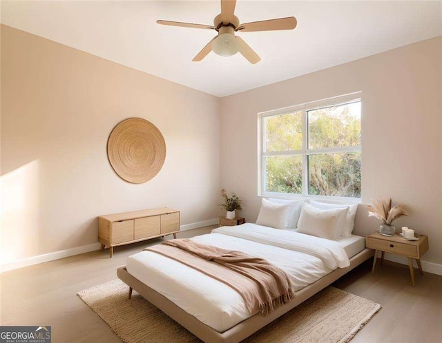 bedroom featuring ceiling fan and light hardwood / wood-style floors