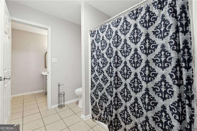 bathroom featuring tile patterned floors, vanity, and toilet