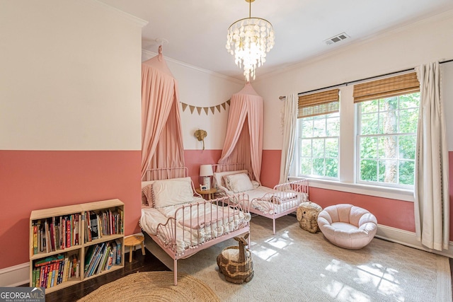 sitting room featuring crown molding, a notable chandelier, and hardwood / wood-style flooring